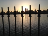 Central Park west and the sun behind bars.